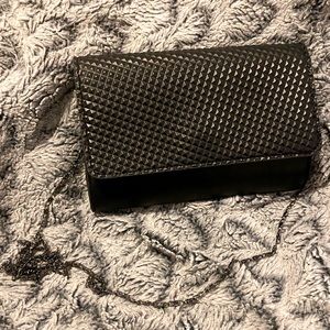 Small black Neiman Marcus going-out clutch with crossbody strap